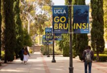 Dorm Attacks Rock UCLA—Mystery Deepens students walking along a tree-lined campus walkway with blue banners on lampposts