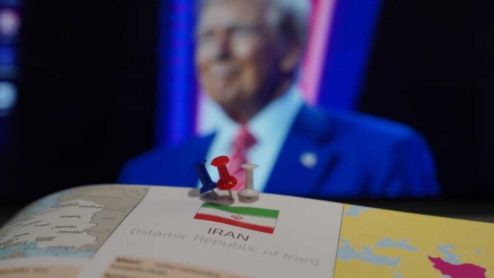 Bosnia,And,Hercegovina,,Travnik,,13.01.2025:,Concept,Of,America,And,Iran Map of Iran with push pins and a blurred figure in the background