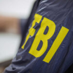 Close-up of an FBI agents jacket with yellow lettering
