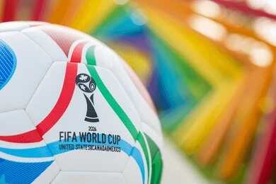 2657999637 Soccer ball with World Cup logo against a colorful background