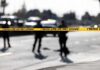 Stabbing Suspect’s Wild Escape Ends Police tape cordons off a street with patrol cars in the background