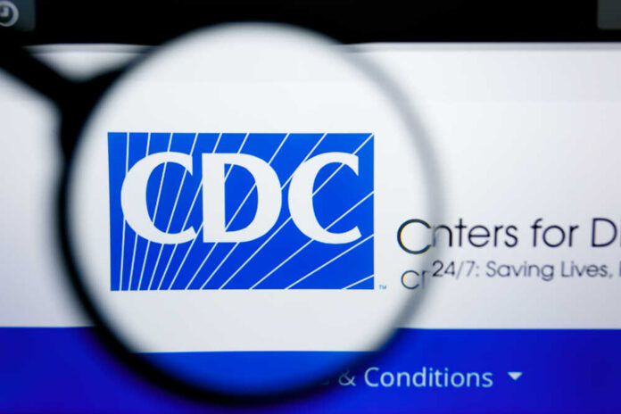 Los,Angeles,,California,,Usa,-,25,June,2019:,Illustrative,Editorial Magnifying glass focusing on the CDC logo on a computer screen