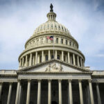 The U.S. Capitol building with an American flag flying in front