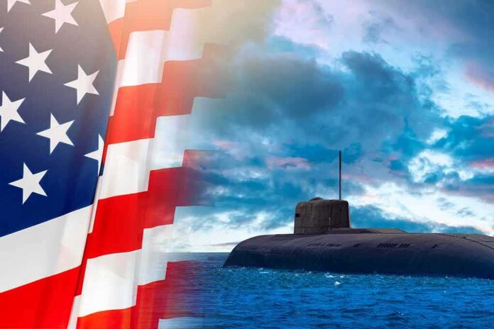 shutterstock_2068617785 Submarine at sea beside a partial American flag