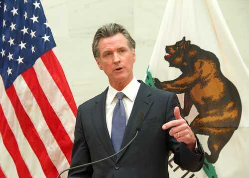 San,Francisco,,Ca,-,April,26,,2022:,California,Governor,Gavin A government official delivering a speech with flags in the background