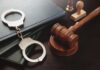 Parents Question California Sex Offender Law Handcuffs and a gavel on a desk with legal books