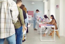 Paperwork Trap Looms Under Trump’s SAVE Act People waiting in line at a polling station to cast their votes