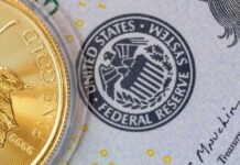 Inside Warsh’s First Fed Meeting Close-up of a gold coin next to a US dollar bill