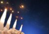 Five-Hour Strike Rocks Iran An aircraft carrier surrounded by various naval ships in the ocean