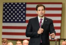 Communism Faces Rubio’s Sharpest Attack man in suit speaking into a microphone