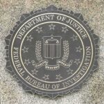 FBI seal on a granite wall