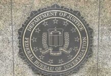 Shadow Trip: FBI Boss Heads to Moscow FBI seal on a granite wall