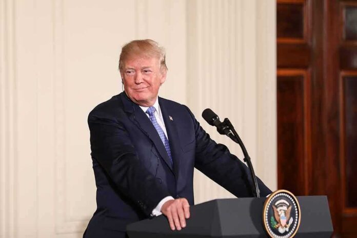 shutterstock_1082158661 man at podium with presidential seal