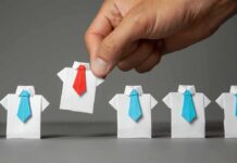 Prime-Age Pullback Alarms Economists Hand picks origami shirt with red tie among blue-tied shirts