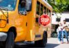 California School Bus Chaos Ends In Cuffs School bus with extended stop sign near students on sidewalk
