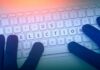 Shock Upset Brewing In Orange County? Gloved hands typing on a keyboard with highlighted election keys