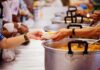North Korea’s Heat Advice Sparks Surprise Hands serving soup at a community kitchen