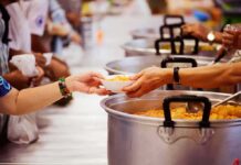 North Korea’s Heat Advice Sparks Surprise Hands serving soup at a community kitchen