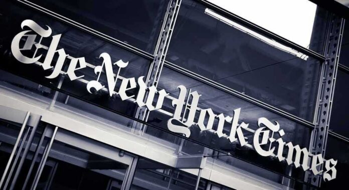 The New York Times sign on a glass building facade