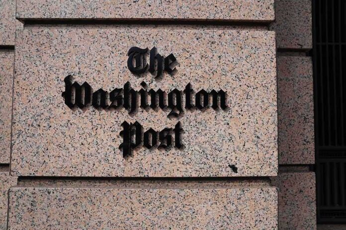 The Washington Post sign on a granite building facade