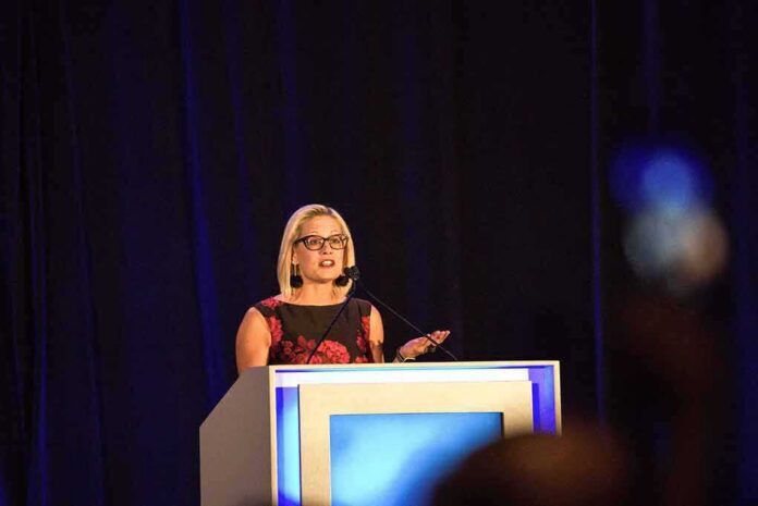 shutterstock_1428813689 Woman speaking at a podium on a stage