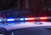 A Late-Night Break-In Leaves Residents Trapped Police car roof with flashing blue and red lights