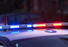 A Late-Night Break-In Leaves Residents Trapped Police car roof with flashing blue and red lights