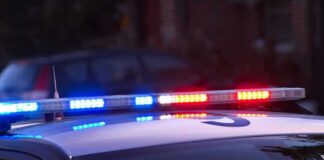 Police car roof with flashing blue and red lights