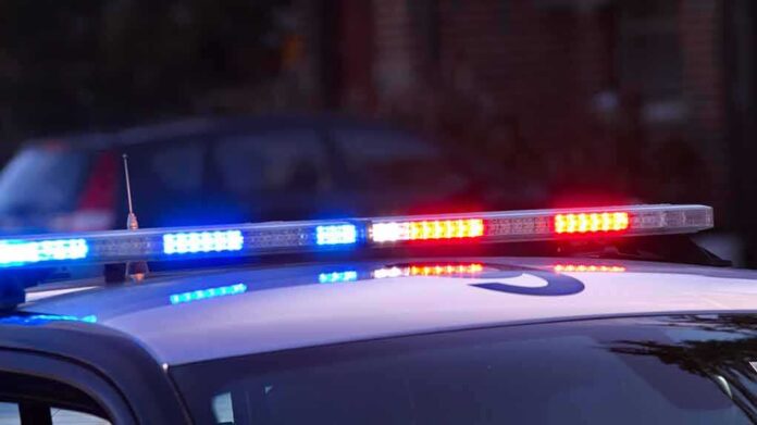 Police car roof with flashing blue and red lights