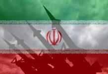 Trump Pauses Planned Strike On Iran Iran flag overlay with missile silhouettes