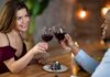 Taxpayer-Funded Date Night? In NYC Two people clink red wine glasses at a restaurant table