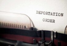 Court Flip Puts 350,000 On The Line Typewriter close-up with document being typed