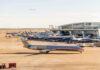 DFW Airport Retreats After Funding Threat American Airlines jets at an airport terminal
