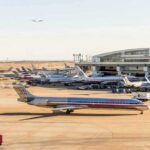 DFW Airport Retreats After Funding Threat American Airlines jets at an airport terminal