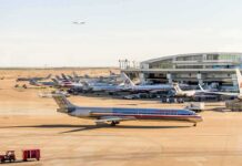 DFW Airport Retreats After Funding Threat American Airlines jets at an airport terminal