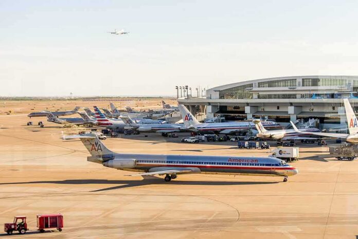 shutterstock_272197994-1 American Airlines jets at an airport terminal