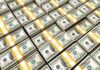 Trump Moves To Squeeze Iran’s Money Machine Stacks of US hundred-dollar bills bundled with yellow straps