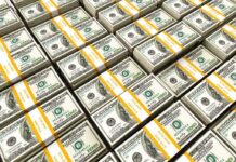 Trump Moves To Squeeze Iran’s Money Machine Stacks of US hundred-dollar bills bundled with yellow straps