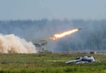 rocket launcher firing missile across a field