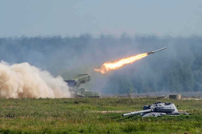 shutterstock_1174977739 rocket launcher firing missile across a field
