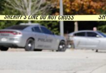 Austin Street Chase Ends With a Bullet Sheriff's line tape blocking a street with police cars behind