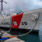Coast Guard cutter moored at a pier