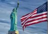 Blue-to-Red Shock Roils Governor Race Statue of Liberty beside a waving American flag