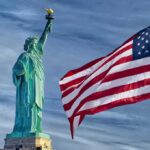 Blue-to-Red Shock Roils Governor Race Statue of Liberty beside a waving American flag