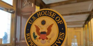 U.S. House of Representatives seal on a glass door