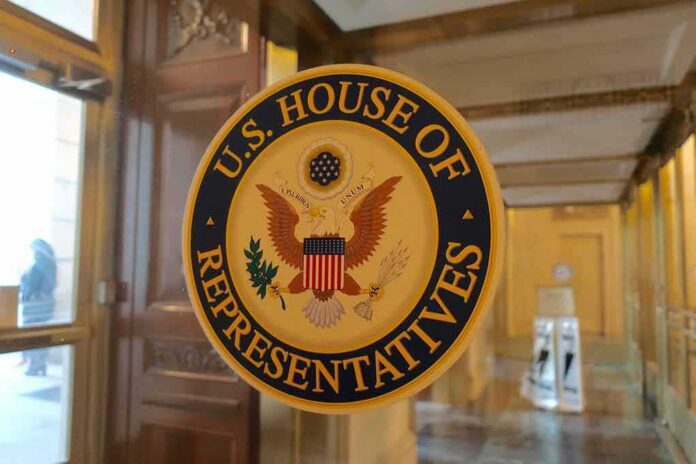 shutterstock_1381876346 U.S. House of Representatives seal on a glass door