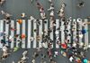 U.S. Foreign-Born Numbers Show Sharp Drop Crowd of pedestrians crossing a zebra crosswalk from above