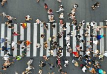 U.S. Foreign-Born Numbers Show Sharp Drop Crowd of pedestrians crossing a zebra crosswalk from above