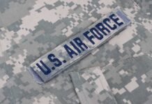 Colonel Hides As Hunters Close In U.S. Air Force name tape on digital camouflage uniform