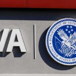 VA logo and Department of Veterans Affairs seal on building wall
